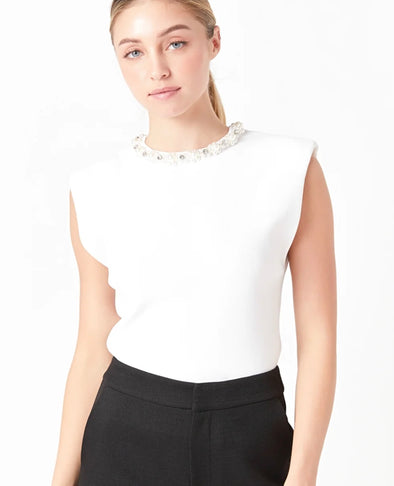 Elevated knit top with embellished neckline